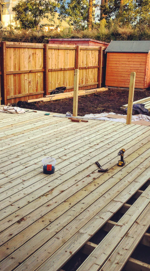 an ongoing construction of a backyard deck